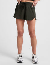 green 2.5" inseam shorts with side pockets and a drawstring at waistband.